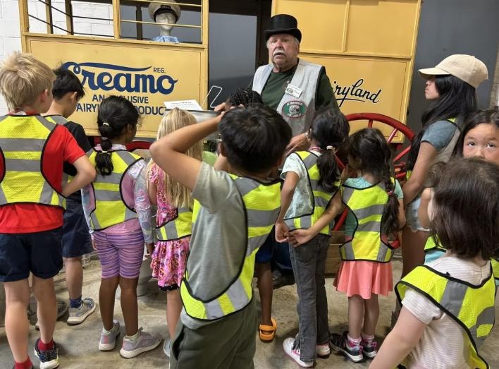 Children on a field trip learning about aviation at Kidspot Surrey